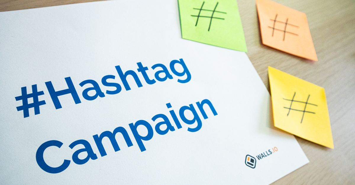 An organized workspace with hashtag campaign materials and colorful sticky notes.