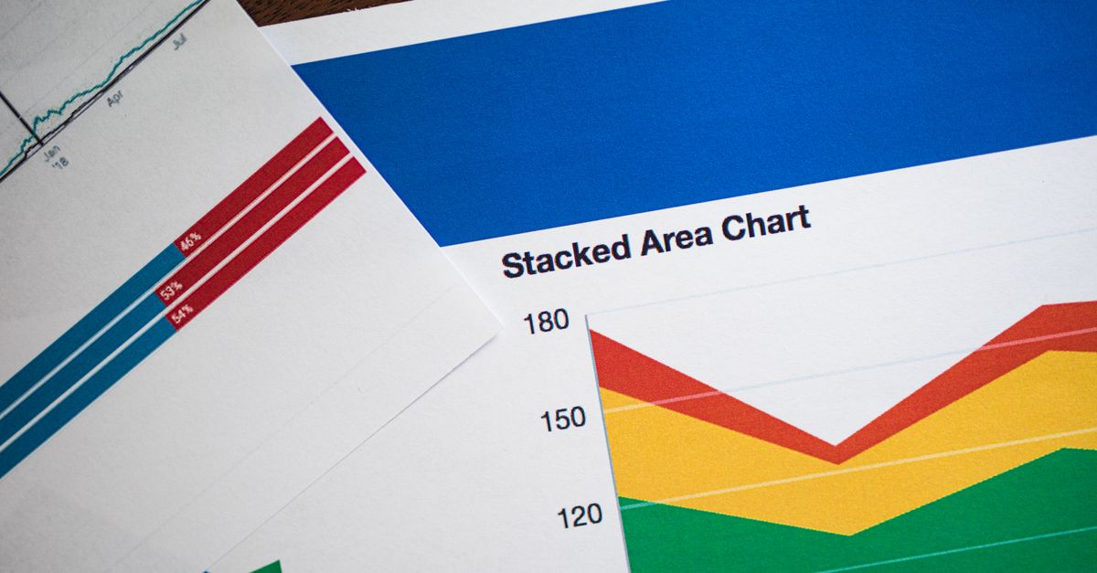 Vivid stacked area chart and graphs on paper, showcasing data analysis.
