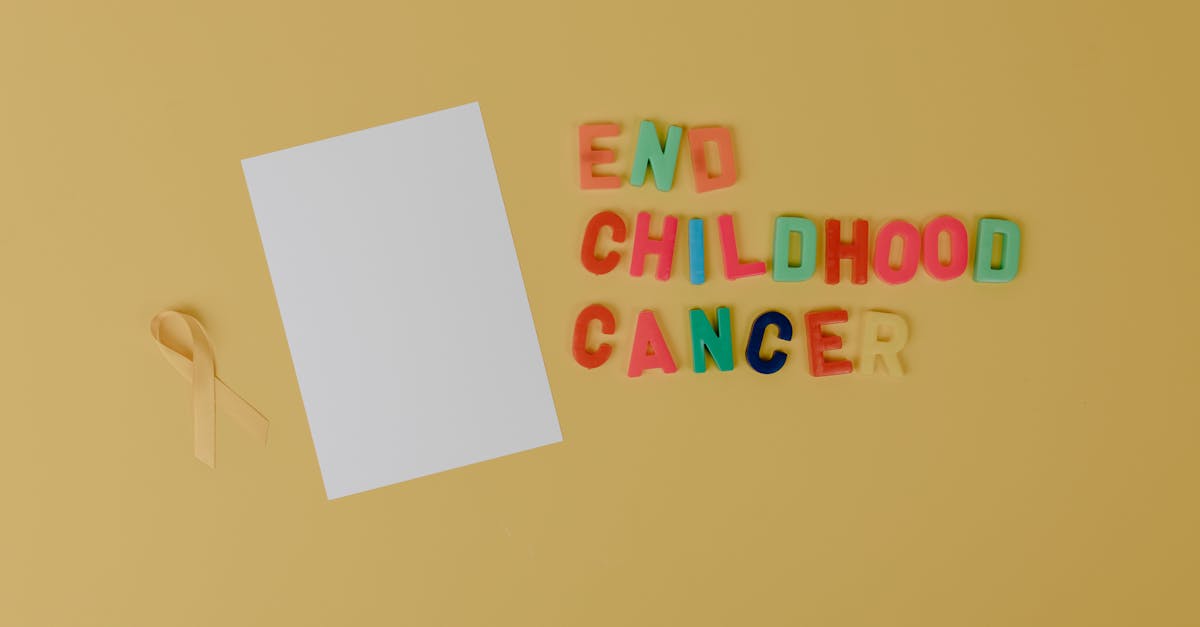 A yellow ribbon and text advocating for ending childhood cancer.