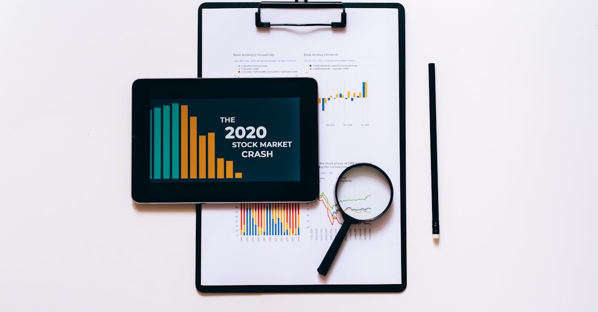 Tablet, magnifying glass, and clipboard for stock market analysis.